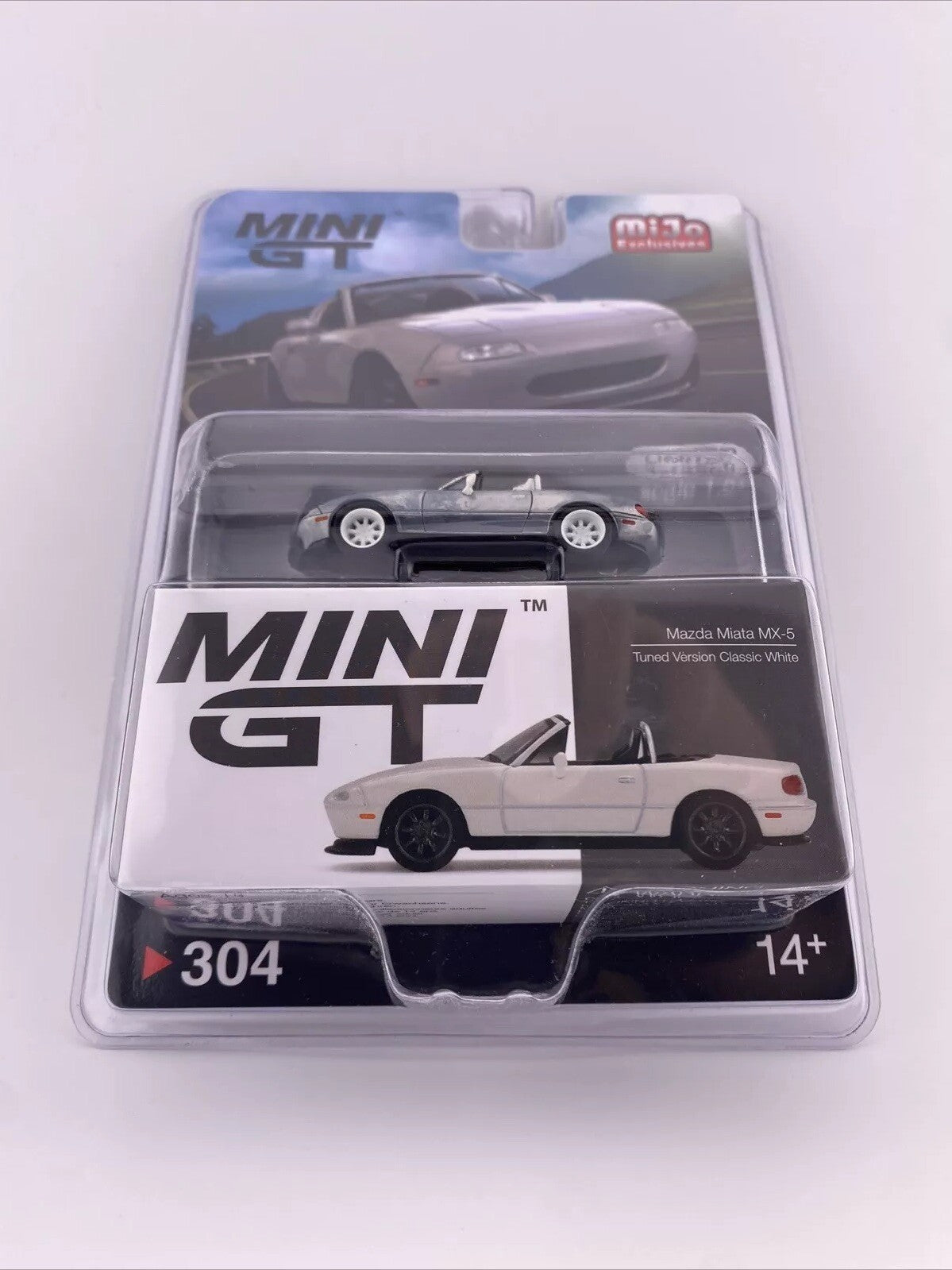 Chase   Mazda Miata MX 5 (NA) Raw Metal / Classic White   Mini GT MGT 003043