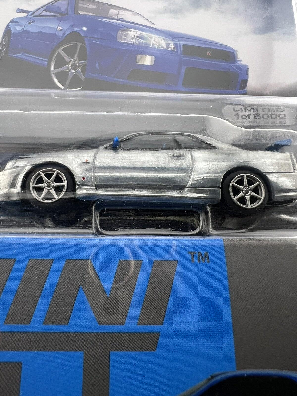Chase   Nissan Skyline GT R (R34) V Spec II Bayside Blue   Mini GT MGT 003416