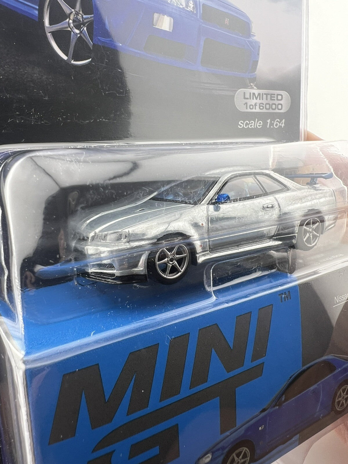 Chase   Nissan Skyline GT R (R34) V Spec II Bayside Blue   Mini GT MGT 003415