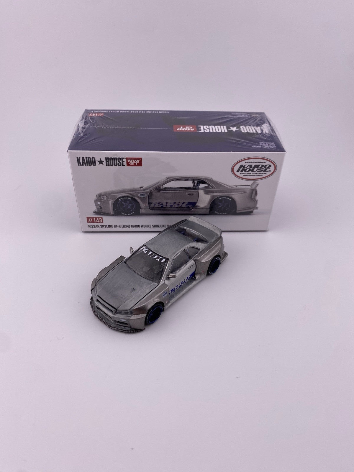 Chase   Nissan Skyline GT R (R34) Kaido House Shinjuku   Mini GT KHMG 1431